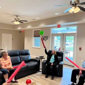 Seniors playing toss the balloon