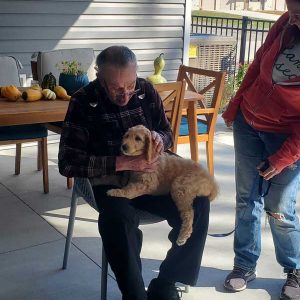 Senior man holding a dog